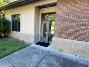 This is the more accessible entrance. However, there is not an automatic doorway.